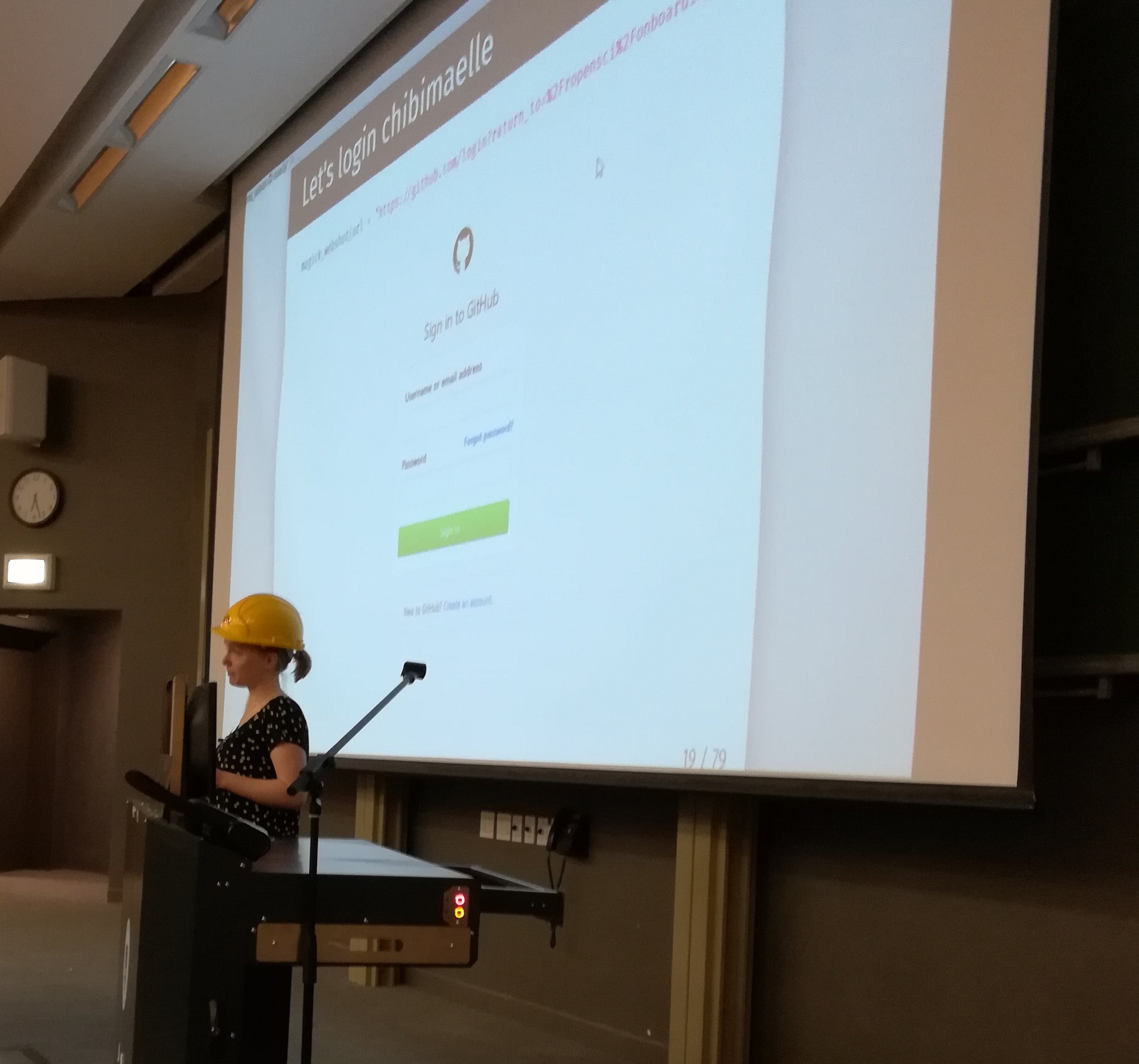 Maëlle giving a presentation while wearing a hard hat
